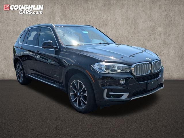 2017 BMW X5 xDrive35i in Jet Black — front three-quarter view