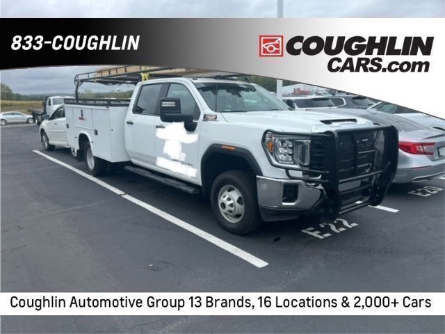 2023 GMC Sierra 3500HD CC Pro in Summit White — front three-quarter view