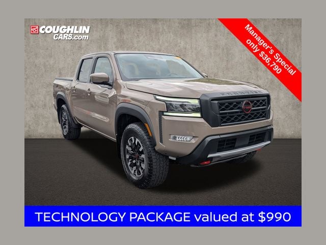 2024 Nissan Frontier PRO-4X in Baja Storm — front three-quarter view