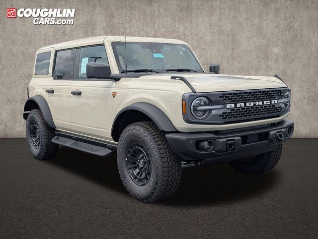 2026 Ford Bronco Badlands in Desert Sand — front three-quarter view