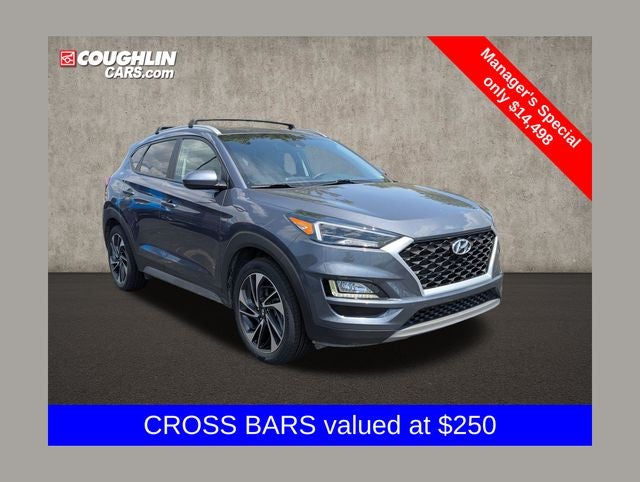 2021 Hyundai Tucson Sport in Magnetic Force — front three-quarter view