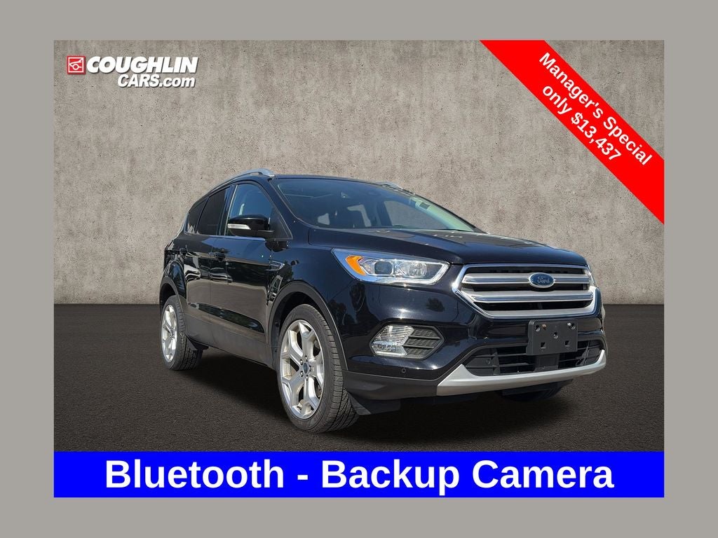 2019 Ford Escape Titanium in Black Metallic — front three-quarter view