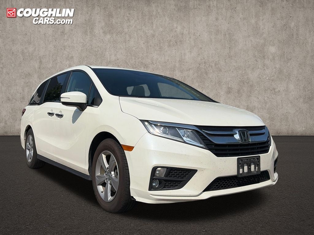 2019 Honda Odyssey EX-L in White Diamond Pearl — front three-quarter view