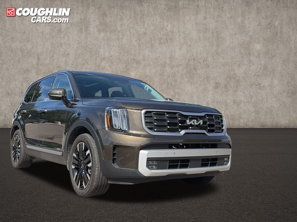 2024 Kia Telluride SX in Dark Moss — front three-quarter view