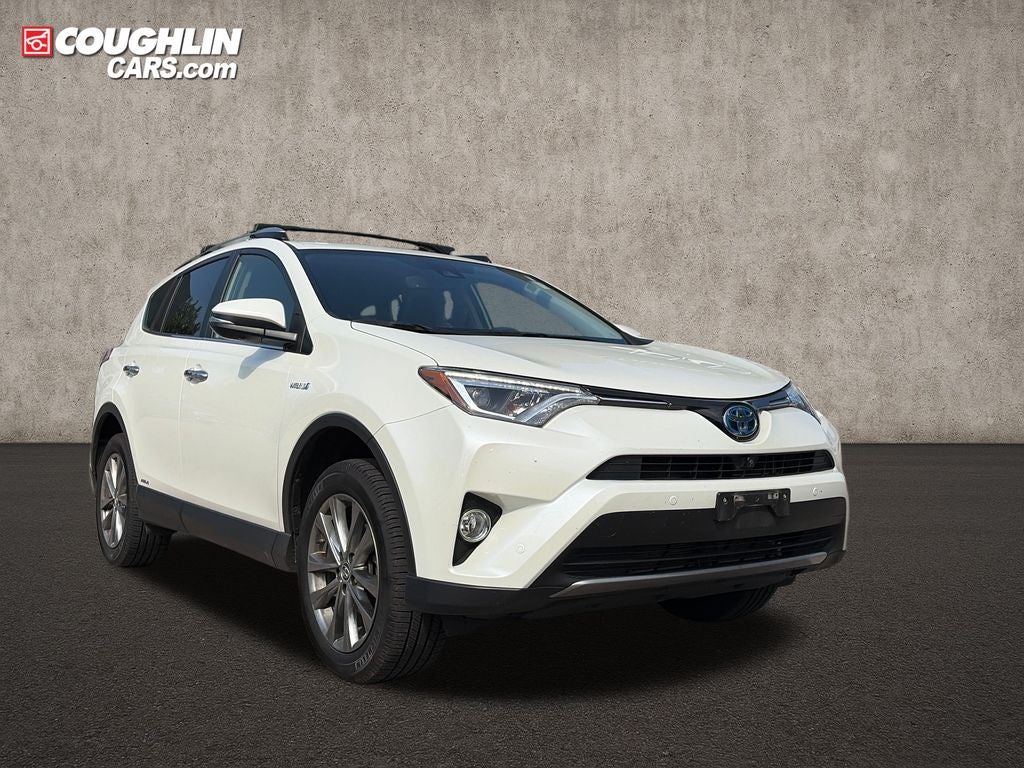 2017 Toyota RAV4 Hybrid Limited in Super White — front three-quarter view