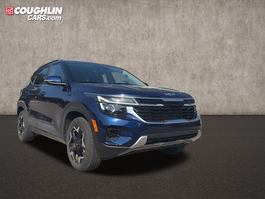 2025 Kia Seltos EX in Dark Ocean Blue — front three-quarter view