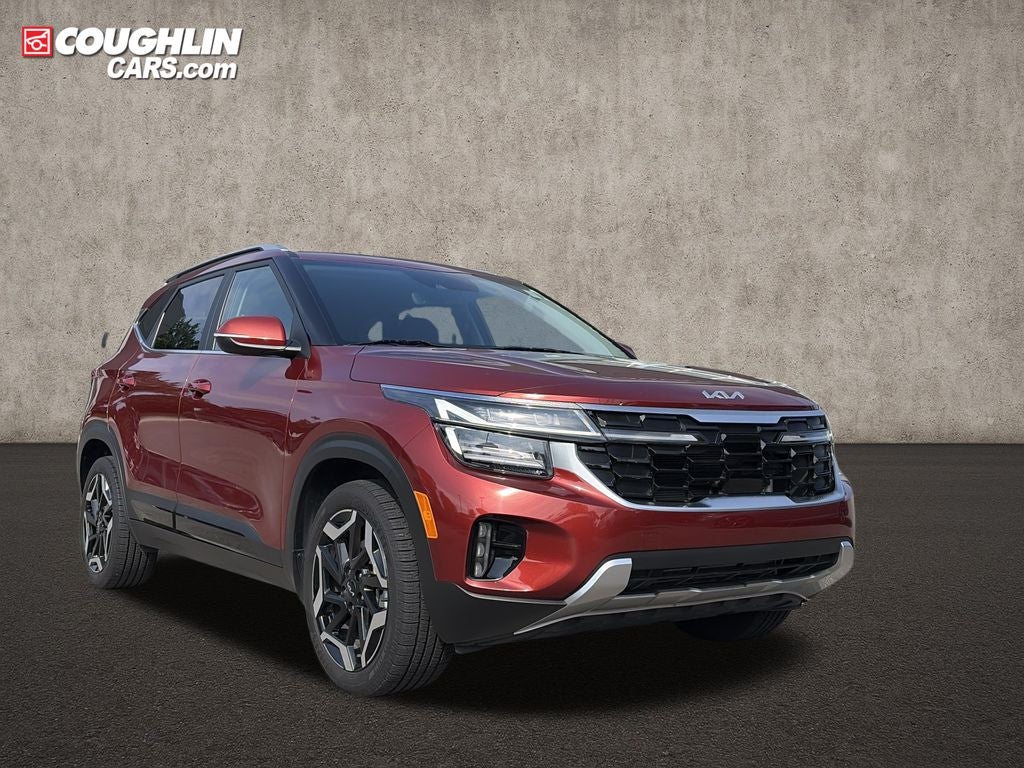 2024 Kia Seltos SX in Mars Orange — front three-quarter view