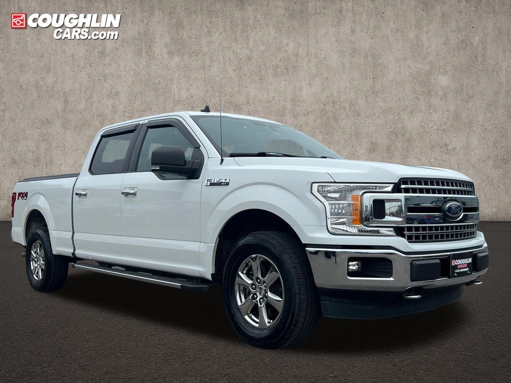 2019 Ford F-150 XLT FX4 in Oxford White — front three-quarter view