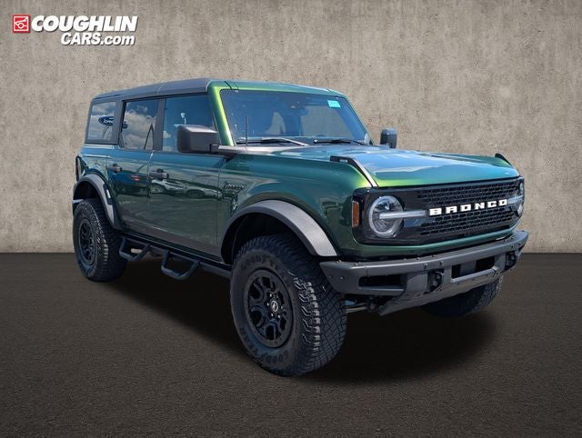 2022 Ford Bronco Wildtrak in Eruption Green Metallic — front three-quarter view