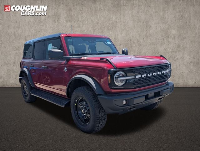 2026 Ford Bronco Outer Banks in Ruby Red Metallic Tinted Clearcoat — front three-quarter view