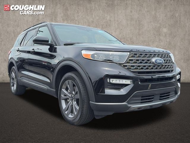 2024 Ford Explorer XLT in Agate Black Metallic — front three-quarter view