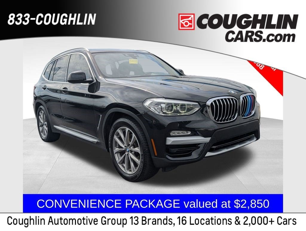2019 BMW X3 xDrive30i in Black — front three-quarter view