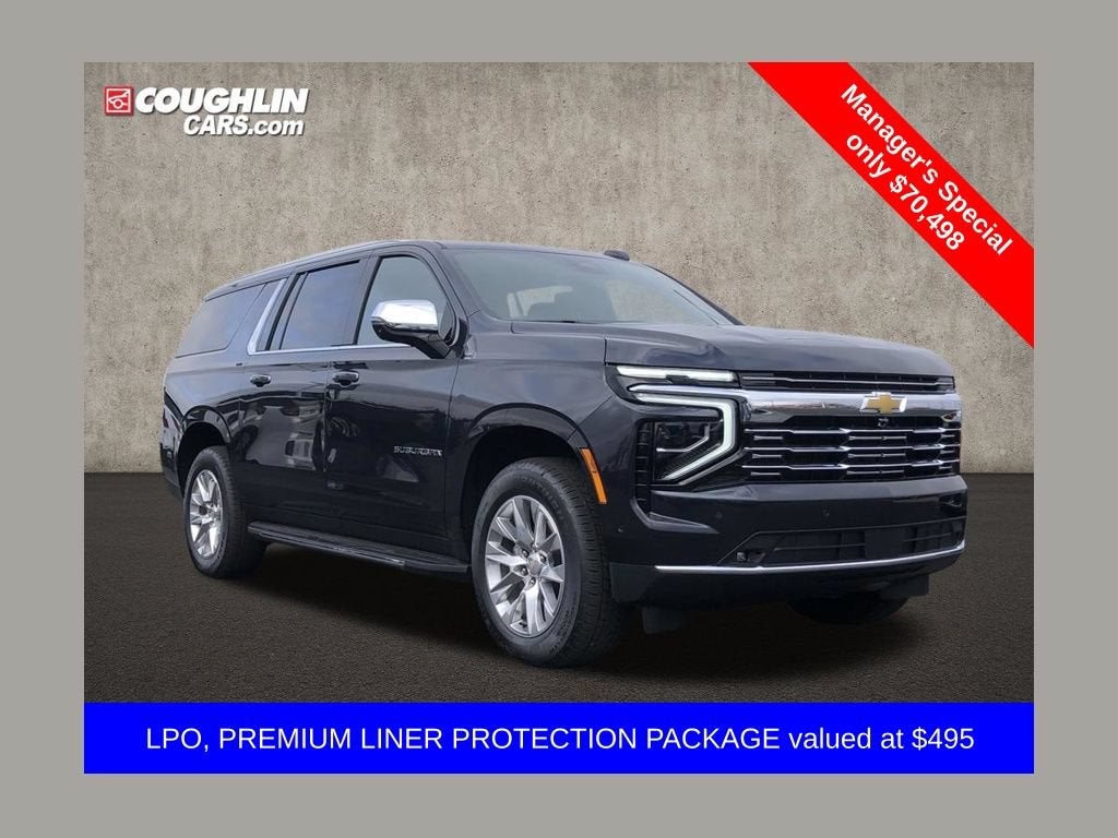 2025 Chevrolet Suburban Premier in Dark Ash Metallic — front three-quarter view